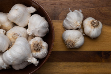 Bowl of Garlic on a wooden countertop
