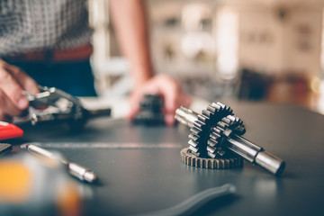 Mechanical engineers are working on the caliper to measure the gear. To design the machine