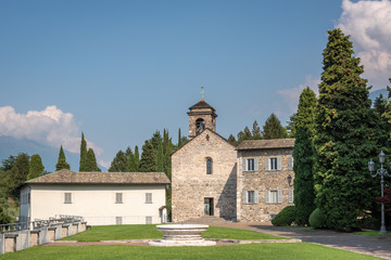 Naklejka premium View of Piona Abbey. Abbey of Holy Mary of Piona, (Abbazia di Piona), Lake Como, Italy.