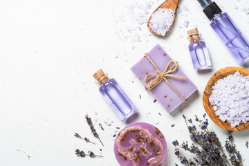 Lavender cosmetics on white top view.