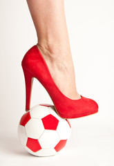 High heel shoe and soccer ball