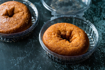 Take Away Donuts with Cinnamon in Plastic Box Package / Container.