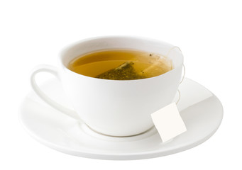 Cup of tea with a saucer and a label for text on a white background. Isolated
