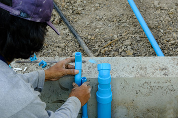 plumber man worker install pvc pipe for infrastructure building house