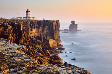 View Of Lighthouse And Sea In Peniche Portugal At Sunset - obrazy, fototapety, plakaty