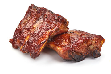 Delicious spicy marinated ribs in a bbq or tomato sauce, isolated on white background