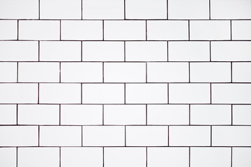 background of white ceramic classic rectangular tiles, wall in the bathroom