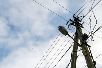 Fototapeta premium Electrictity pole in a blue sky