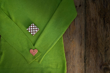 Valentine's day gift heart and box on a green pullover