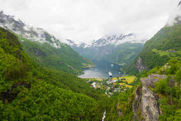 Fototapeta na wymiar Geiranger / Norway 06.29.2015Panoramic view of Geiranger Fjord on cloudy day