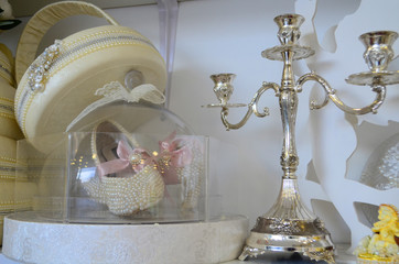 Decorated area with white wooden candle lamps and flowers