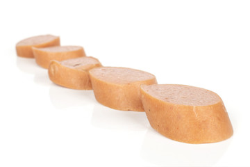 Group of five slices of pork frankfurt sausage isolated on white background
