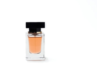 transparent glass bottle of perfume with black cover, isolated on white background