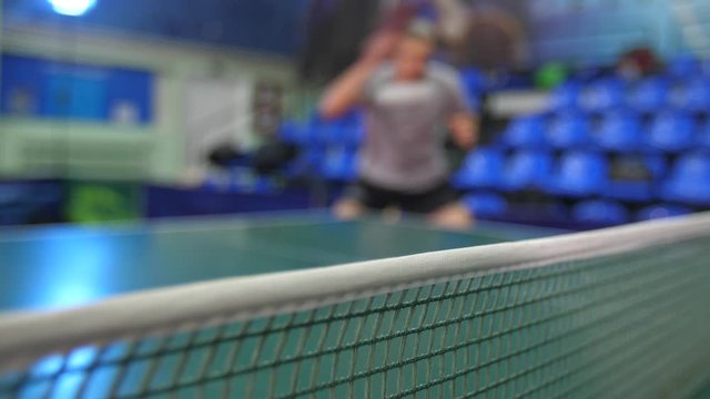 Man play at ping pong