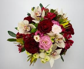Flower composition, handmade by florists with roses and orchids.