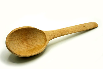 Wooden kitchen utensils on white background. Handcrafted wooden spoon.