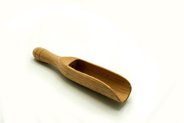 Wooden kitchen utensils on white background. handcrafted wooden shovel.