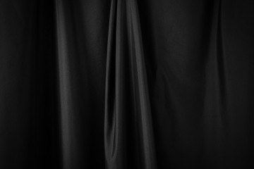 Black luxury fabric background, drapery texture