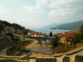 Old town in Ochrid City, amphitheater and water of Ochrid Lake as background.