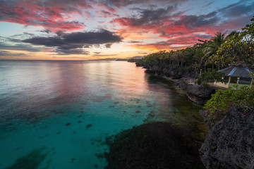 Fototapeta na wymiar sunset with Turquoise blue water and beatiful beach on philippines island bohol anda. Diving swimming snorkeling travel vacation 