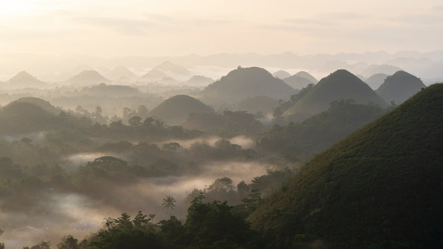 Panorama view of chocolate hills in Bohol, philippines at sunrise, mist fog, carmen, Asia