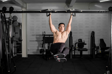Fototapeta premium Muscular fitness man bodybuilder is workout in gym