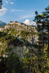 Fototapeta premium View of Fort Victor-Emmanuel. Dominating the Arc Valley , the rocky foothills of Esseillon, a natural defensive barrier a hundred metres high, blocks the access to the Haute-Maurienne Valley. 