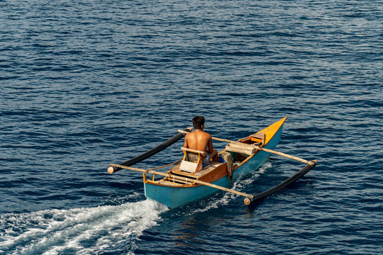 Philippine fisher on banca boat in the morning on island cebu