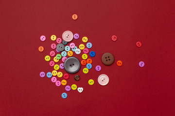 Bright colored buttons on a dark red background