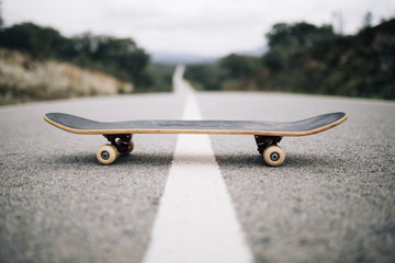 wooden skateboard on the road