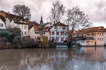 Fototapeta premium Scenic view of Old town over the Regnitz river in winter day in Bamberg, Bavaria, Upper Franconia, Germany