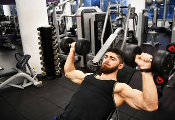 male athlete goes in for sports in the gym