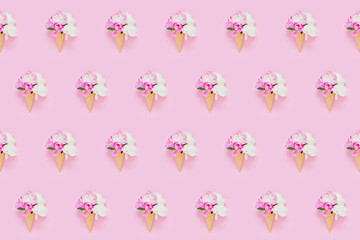 Peonies flowers bouquet in waffle ice cream cone on light pink background. Seamless pattern. Summer concept.