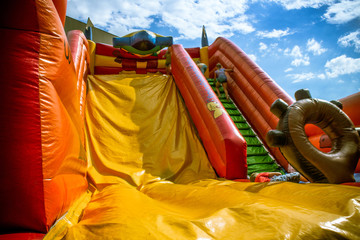 Kids on inflatable slides