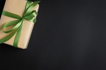 gift on a dark background, top view on a gift box