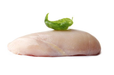 raw chicken fillet with basil isolated on a white background