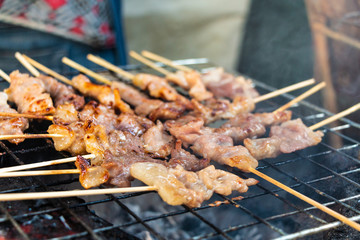 grilling pork in local market