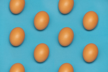 Easter eggs pattern on a blue background