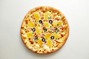 Pineapple and olive pizza on white background 