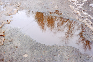 Paved road covered with melting snow