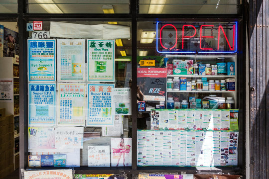 medicine and chinese newspaper and ads in a pharmacy in china town in San Francisco