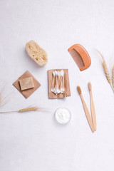 bathroom accessories made of wood and bamboo on linen. have copy space. vertical photo