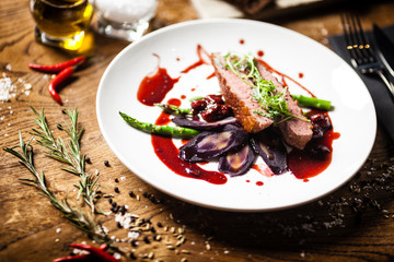 Duck breast served on a plate in restaurant