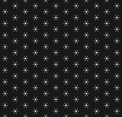 Vector snowflakes seamless pattern. Abstract minimalist black and white texture with tiny geometric floral shapes, snow flakes. Simple winter holiday background. Stylish repeatable decorative design