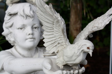 Child Statue Releasing Dove