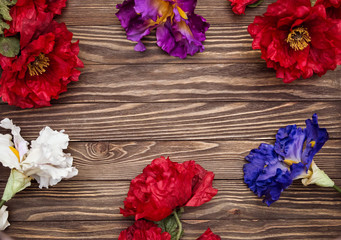 Large different flowers top view on Valentine's day isolated on wooden background. Flat lay Copy space