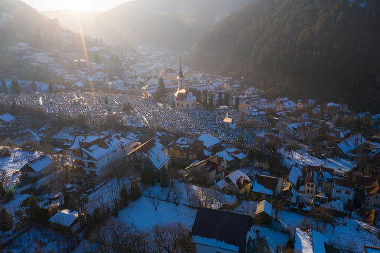 Aerial drone shot of Brasov historical neighborhood Schei at sunset on a beautiful winter day