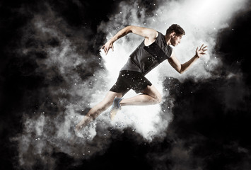 Obraz na płótnie Canvas Sporty young man running