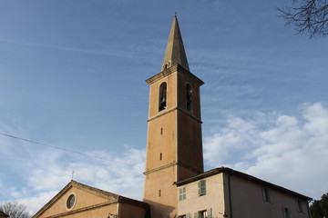 Fototapeta premium old provencal church tower in the blue sky
