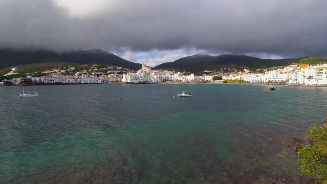 Cadaqu&eacute;s, Catalonia / Spain - November 30th, 2019: Skyline of the old village with an old mediterranean fishing boat